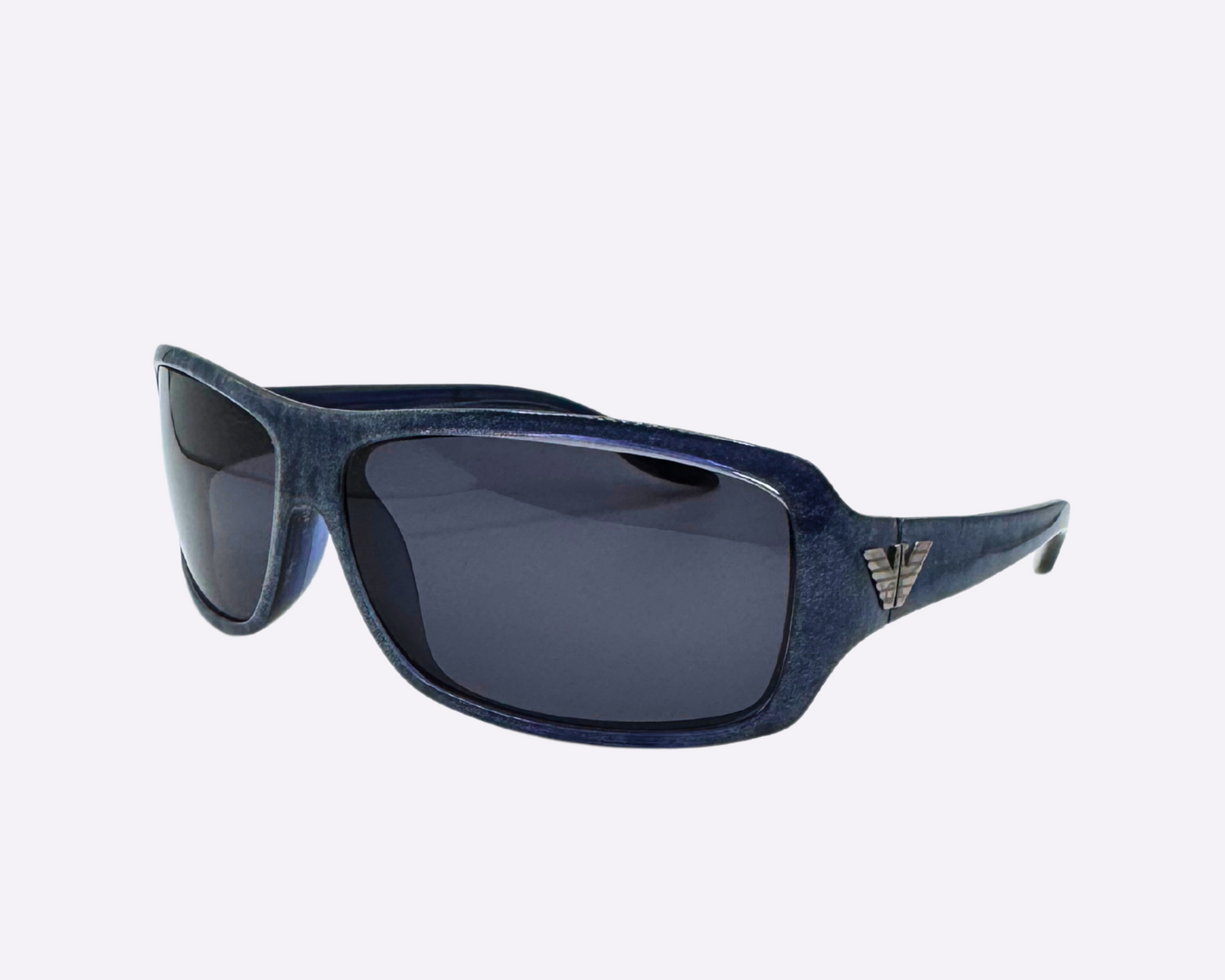Side view of early 2000s Armani sunglasses made in Italy, with a dark blue speckled frame and new grey lenses, shown on a light gray background.
