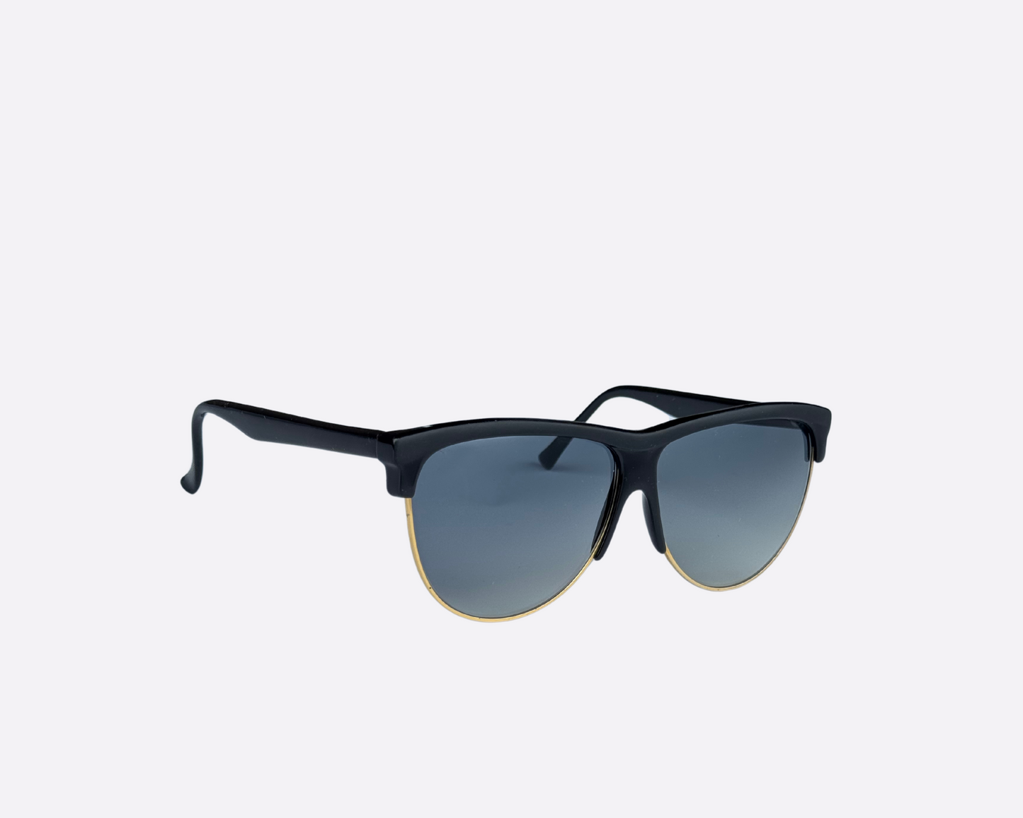 Side view of a pair of Piave sunglasses with gradient grey lenses and a black frame, displayed against a white background.