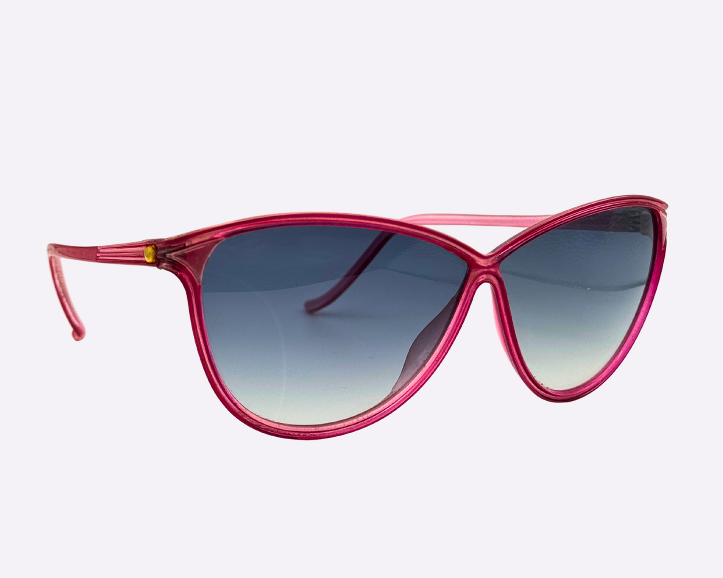 Side view of Christian Latour sunglasses with a pink frame and new gradient grey lenses, shown on a white background.