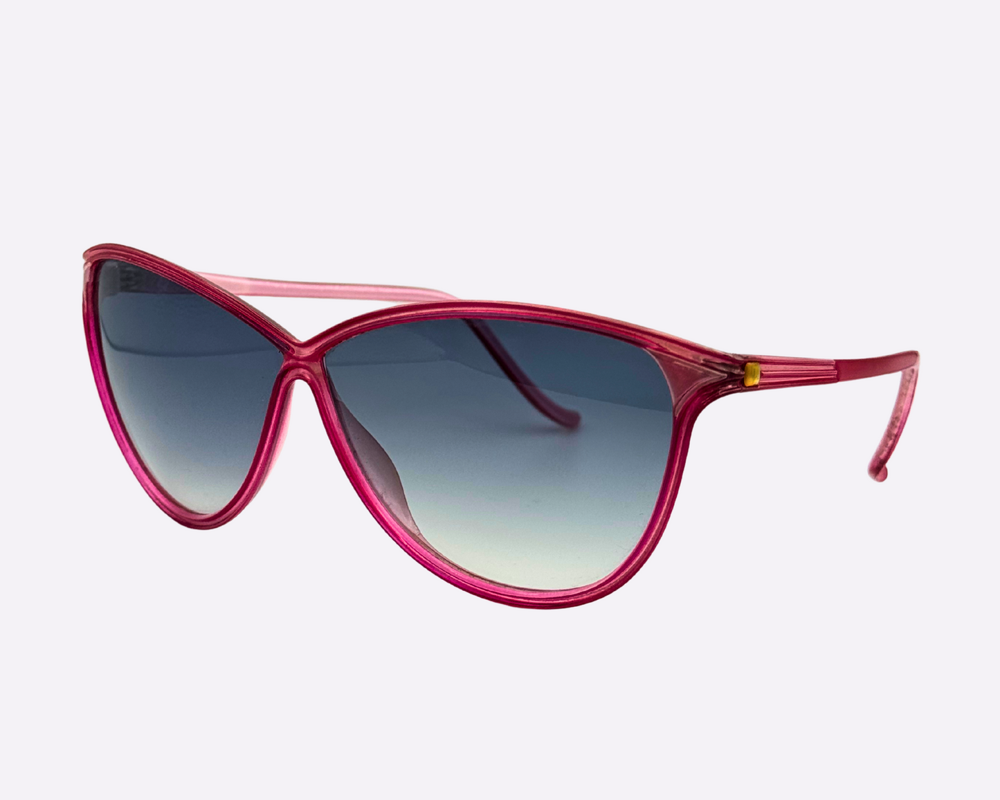 Side view of Christian Latour sunglasses with a pink frame and new gradient grey lenses, shown on a white background.