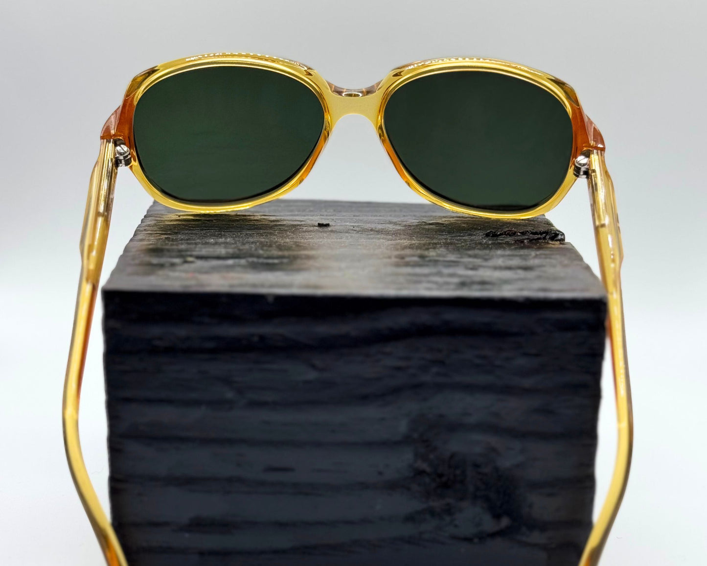 Rear view of Christian Dior model 2262 sunglasses, made in Germany, showing the gold frame and new green lenses.