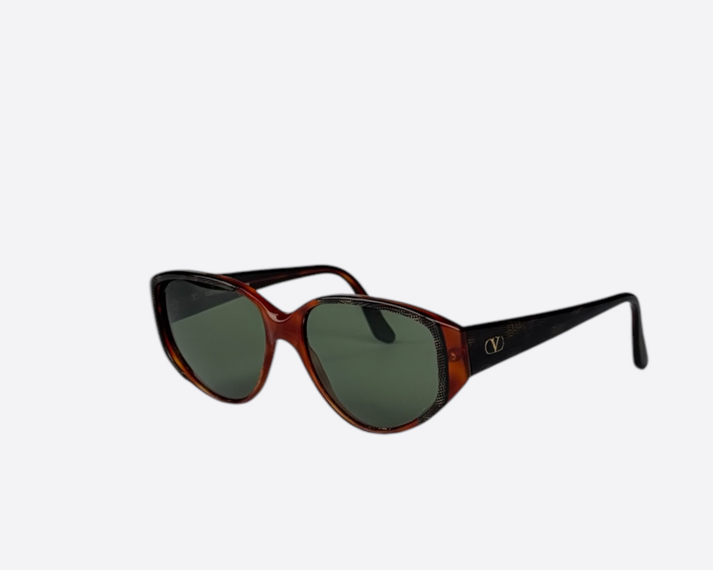 Side view of Valentino V148 322 sunglasses, showcasing the green snake pattern on the temples, visible logo, and the speckled red and brown cat-eye frame from the 1990s.