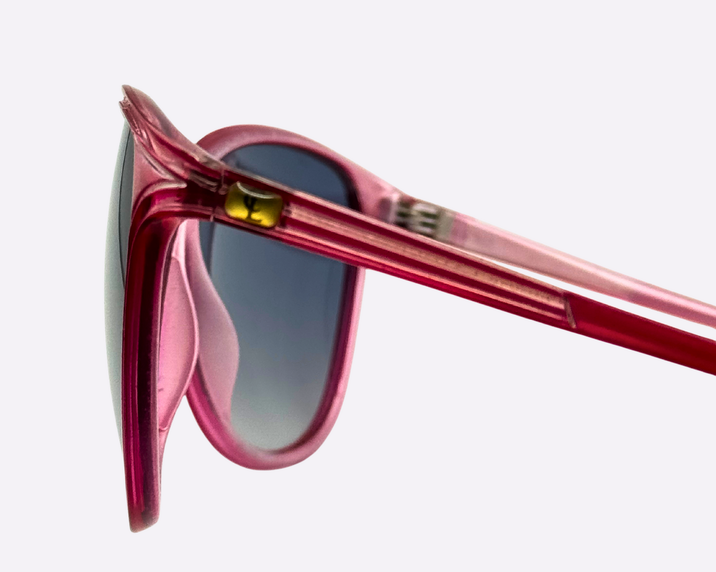 Close-up of Christian Latour pink sunglasses with new gradient grey lenses, showing the CL logo on the left temple.