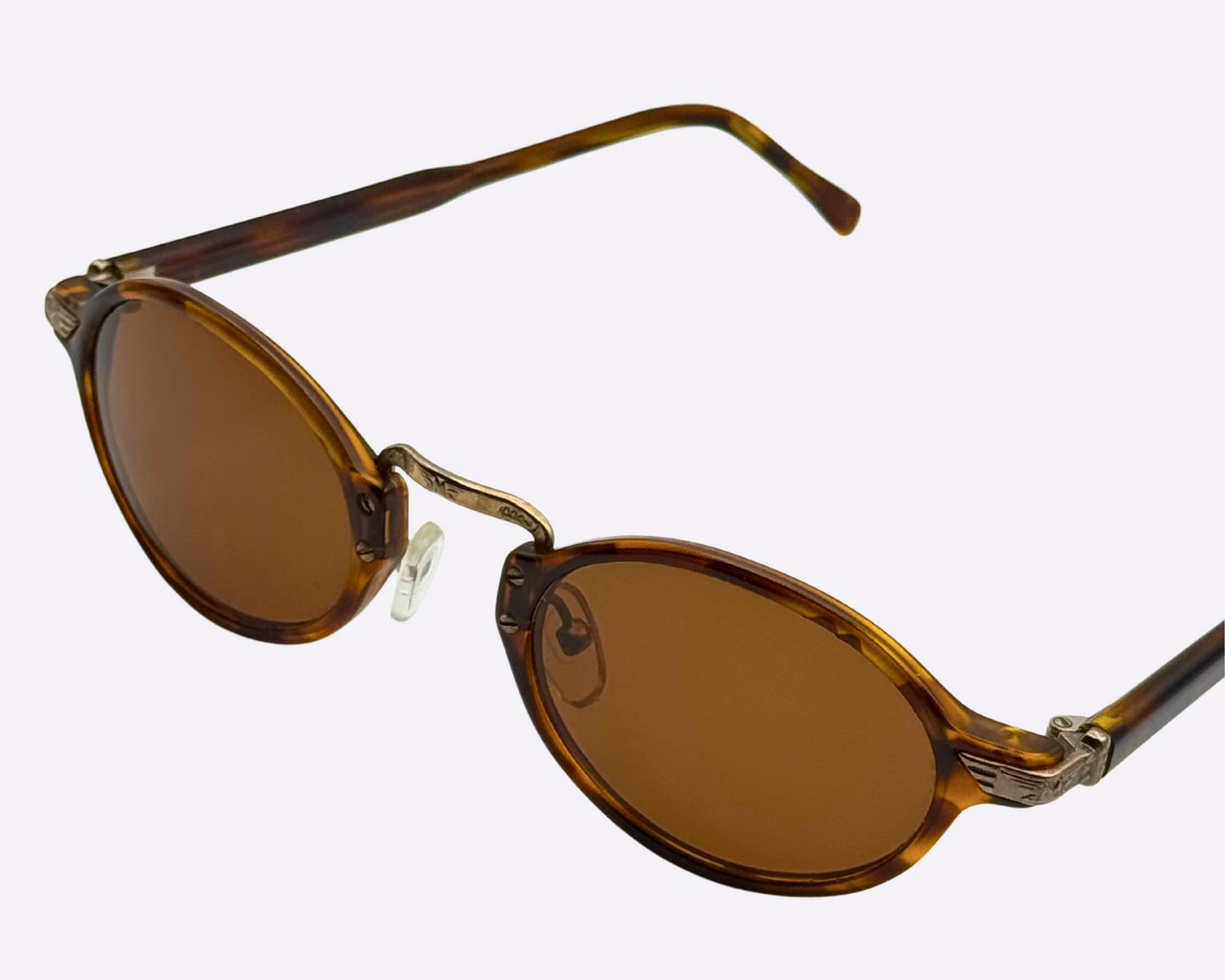 Brown sunglasses with tortoiseshell frames and new brown lenses on a white background