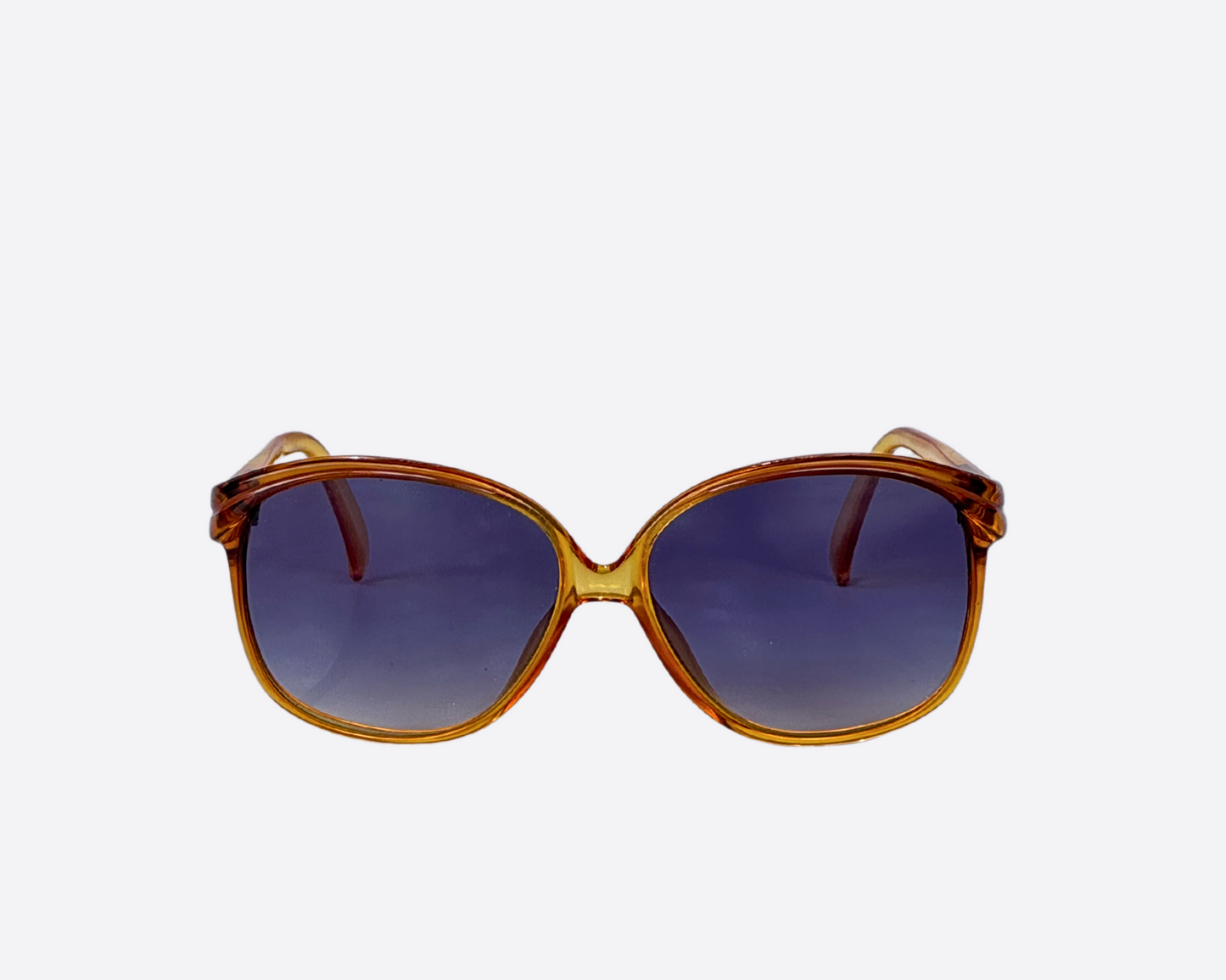 Front view of a pair of retro Terri Brogan sunglasses, model 8786 10, from the 80s with a yellow optyl frame and new grey lenses.