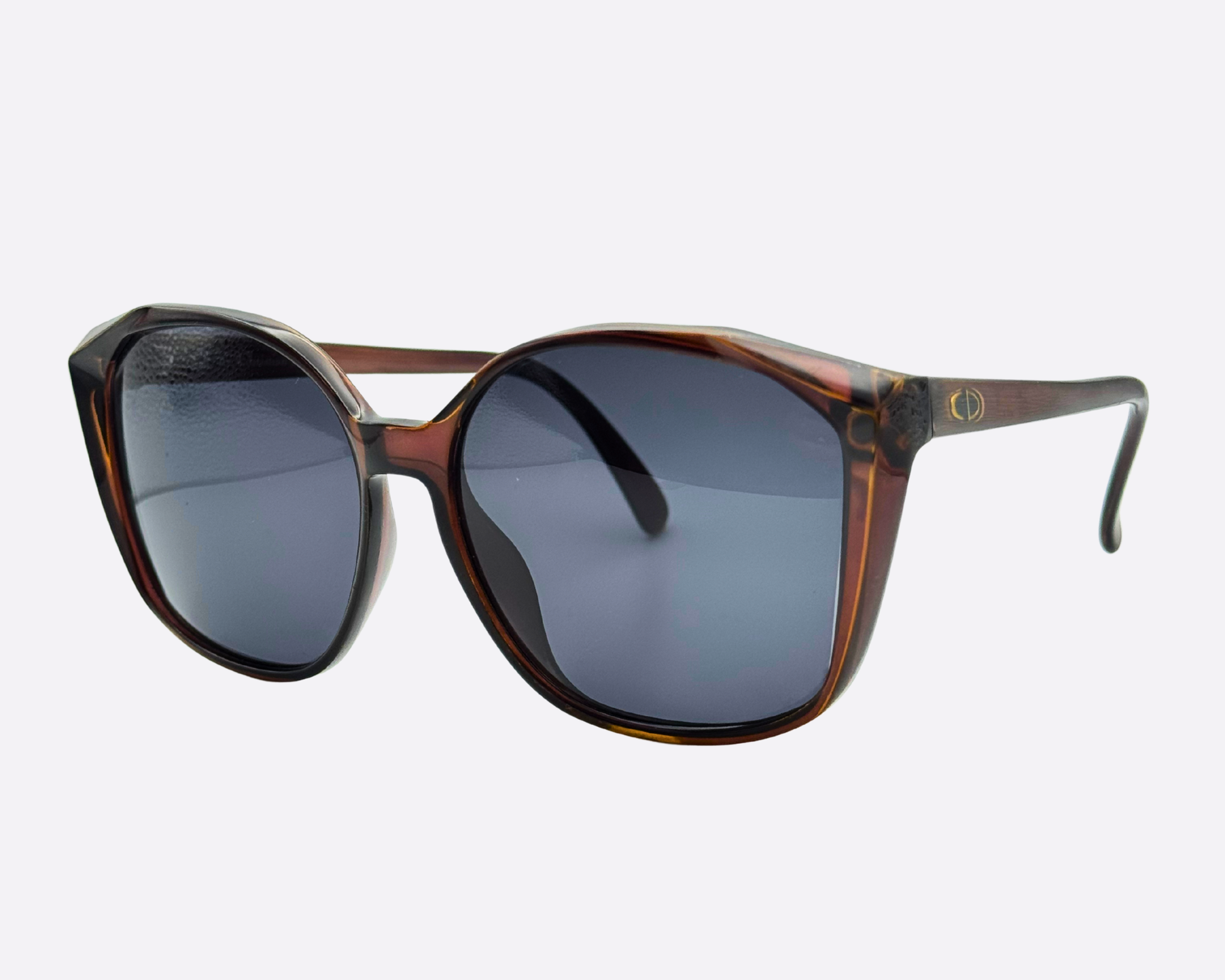 Front view of the oversized 70s Dior 2232 frame in brown tortoiseshell pattern. Features the dark grey lenses and subtle Dior logo on the temple.