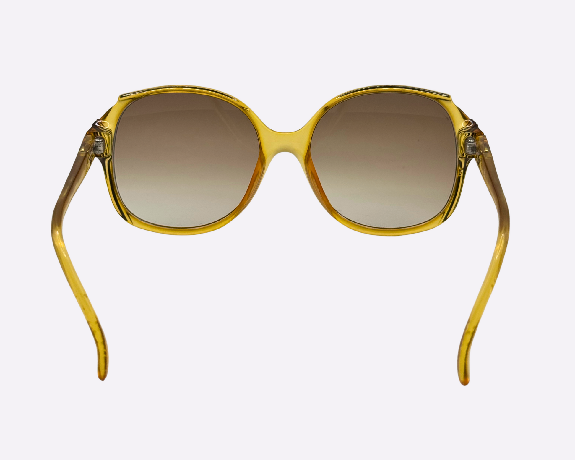 Rear view of vintage 1980s Christian Dior sunglasses, model 2130 31, featuring new brown gradient lenses and made in Germany, shown on a light gray background