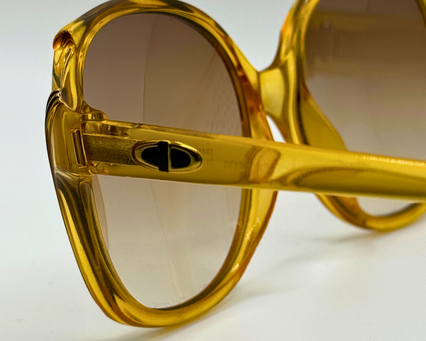 Close-up of the temple and logo on vintage 1980s Christian Dior sunglasses, model 2130 31, with new brown gradient lenses and made in Germany.