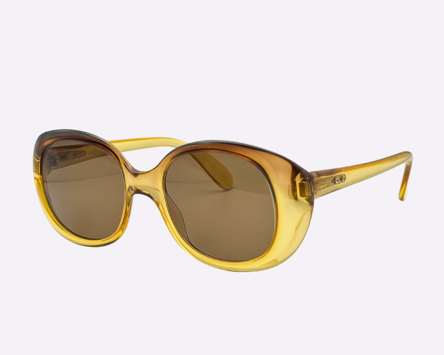 Side view of vintage 1980s Terri Brogan sunglasses, model 8752 80, with thick gold optyl frames.