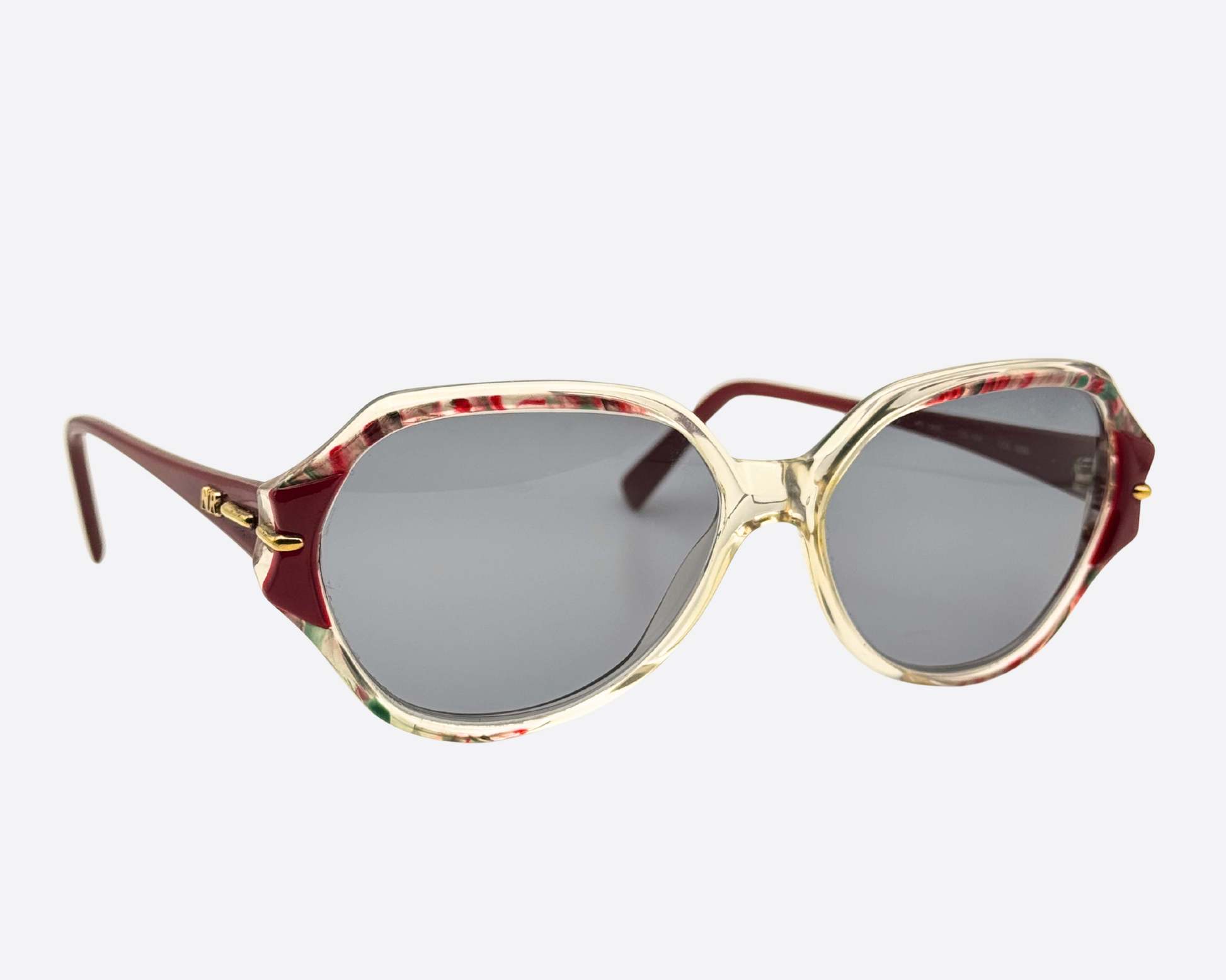 Side view of Nina Ricci Model 2406 vintage sunglasses, late 80s oversized geometric style, luxury French fashion eyewear for collectors.