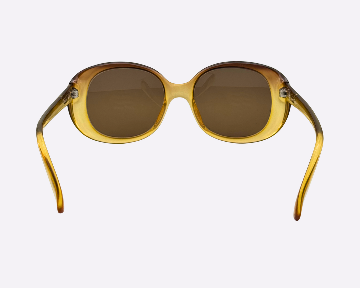 Rear view of vintage 1980s Terri Brogan sunglasses, model 8752 80, featuring thick gold optyl frames and new brown lenses, shown on a light gray background.