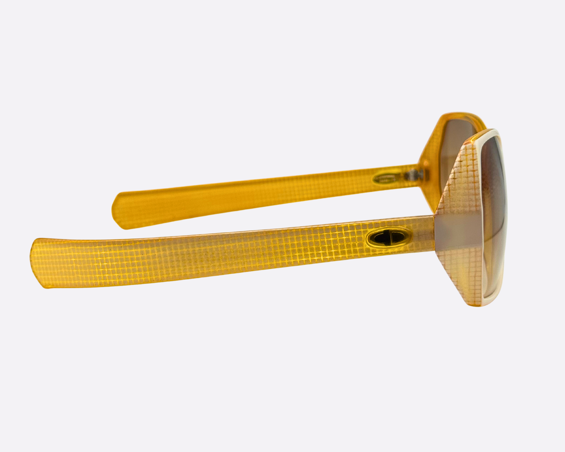 Side view of the Christian Dior 2177 70 sunglasses, showcasing the gold-toned, patterned temples and the oversized frame profile.