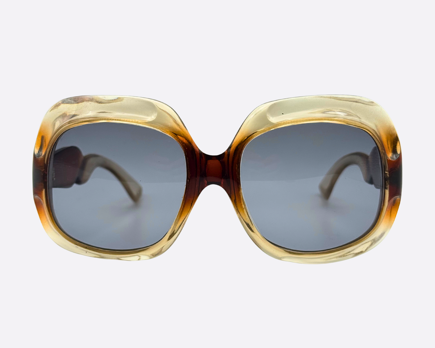 Vintage 1970s oversized French sunglasses with massive square rounded frames, featuring a honey to deep tortoiseshell brown gradient and new grey UV lenses.