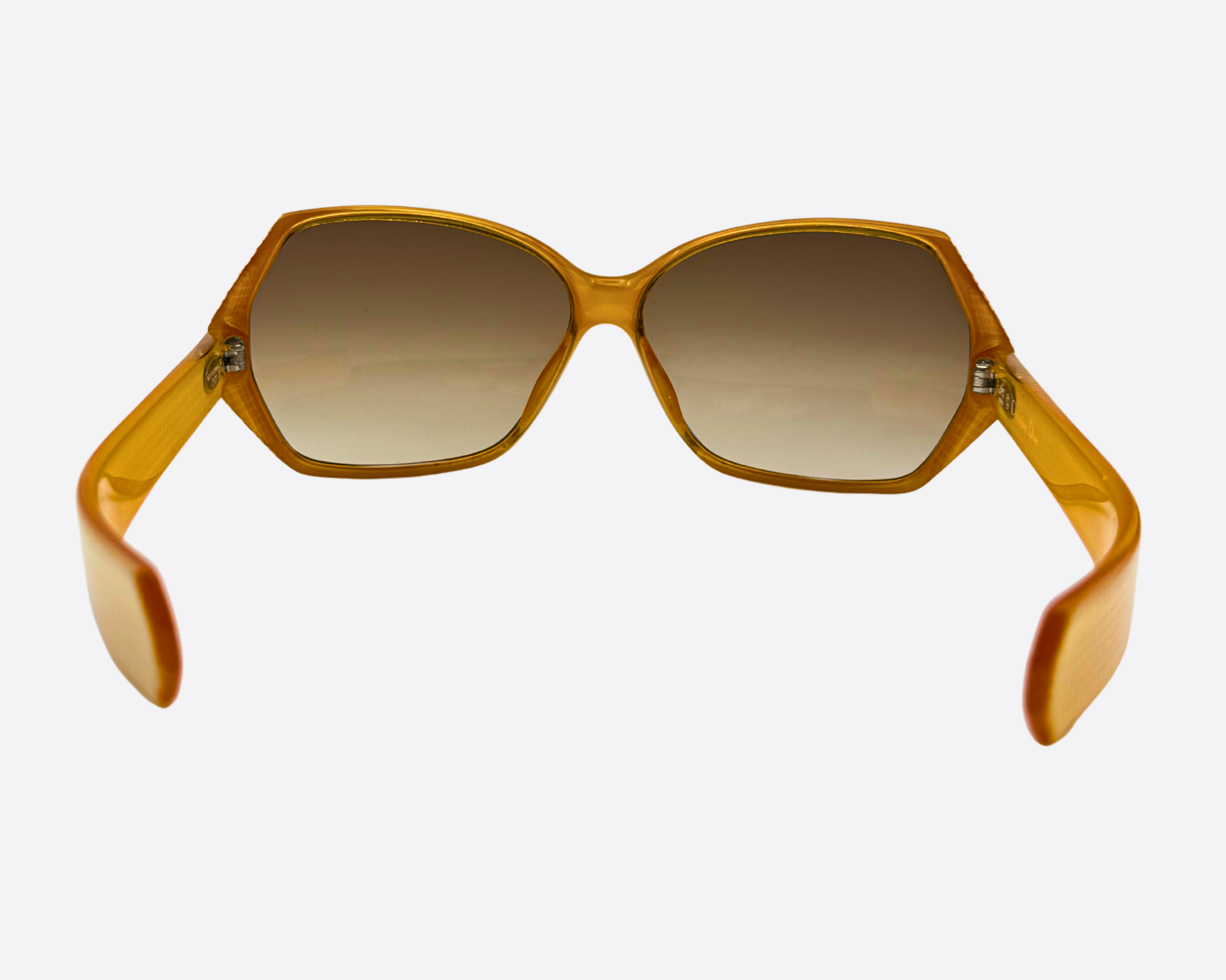 Rear view of the vintage Dior 2177 sunglasses, displaying the wide frame and the pattern on the gold-toned temples.