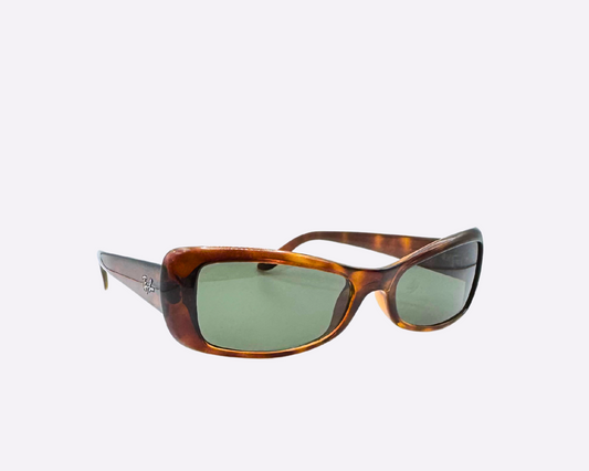 Side view of Italian-made Ray-Ban retro sunglasses from the early 2000s with brown frames and brand-new green G-15 lenses, shown on a light gray background.