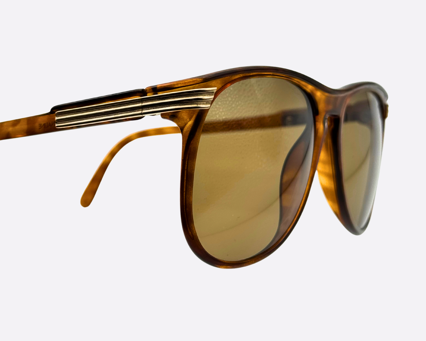 Close-up front-angle view of Viennaline 1200 10 sunglasses, highlighting the polished tortoiseshell acetate texture and the sleek hinge design of the Austrian-made 80s frames.