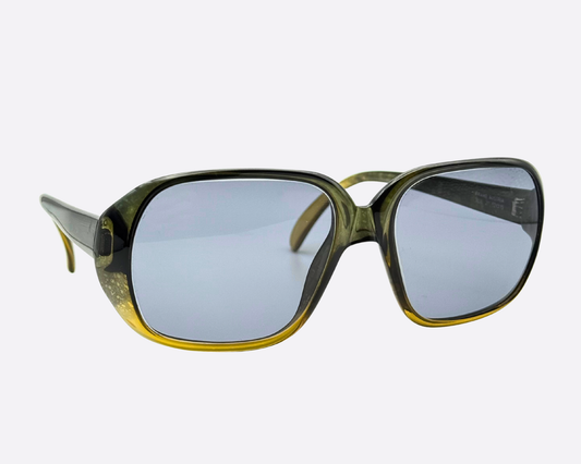 Angle view of Austrian-made Cobra 3036 sunglasses, showing the medium-sized translucent frames and the distinct 70s khaki and yellow color transition.