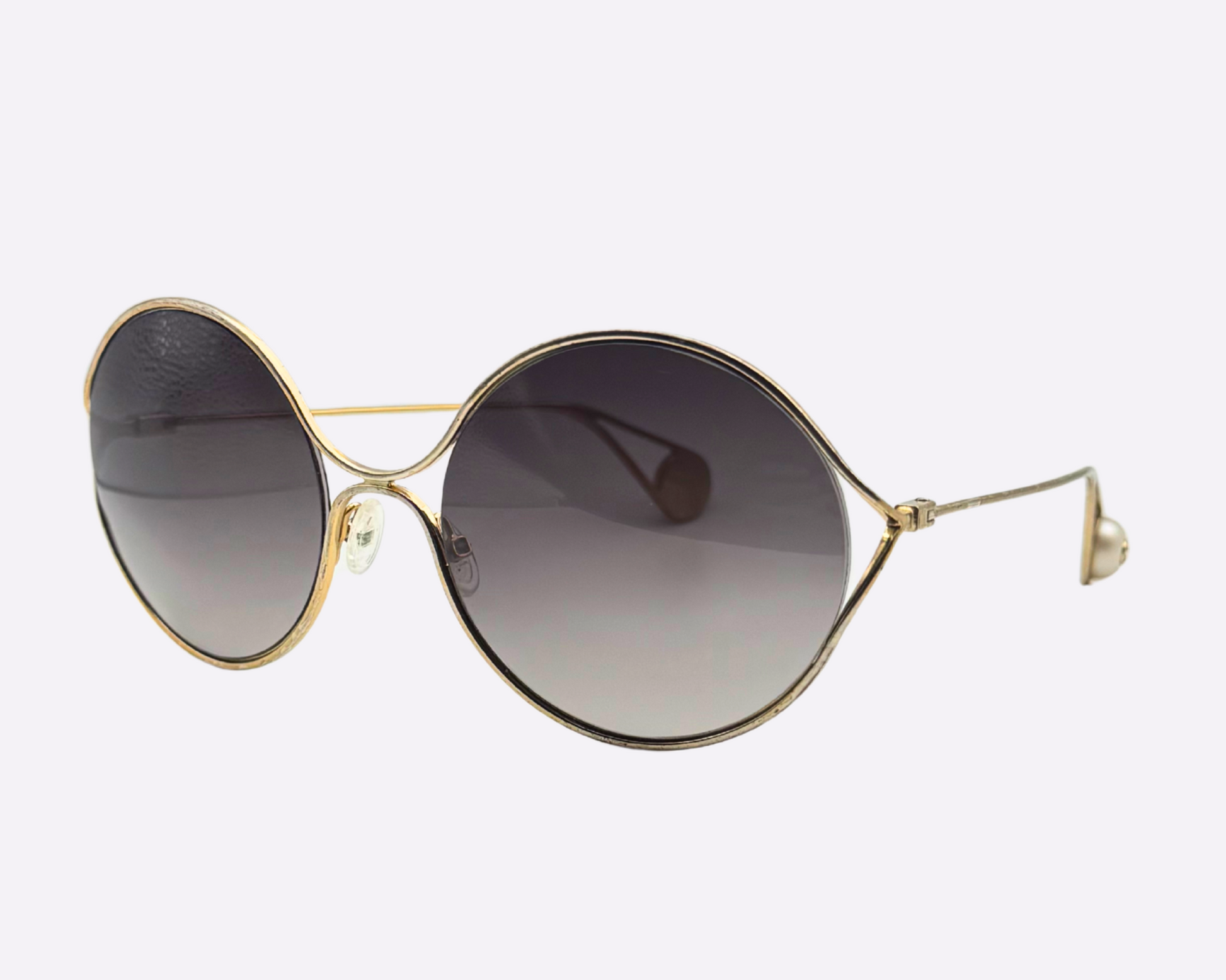 Side view of Gucci oversize sunglasses featuring a steel frame and new grey lenses, shown on a white background