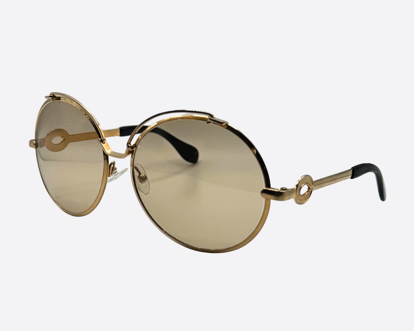 Silhouette – Oversized Gold Metal | 70s Vintage