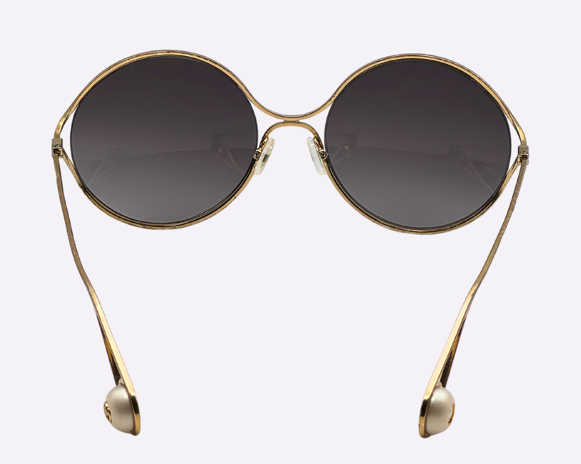 Rear view of new Gucci oversize sunglasses with a steel frame and new grey lenses.
