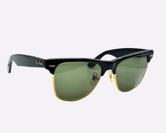 Side view of vintage 1980s Ray-Ban Wayfarer Max sunglasses featuring new green G-15 lenses on a white background.