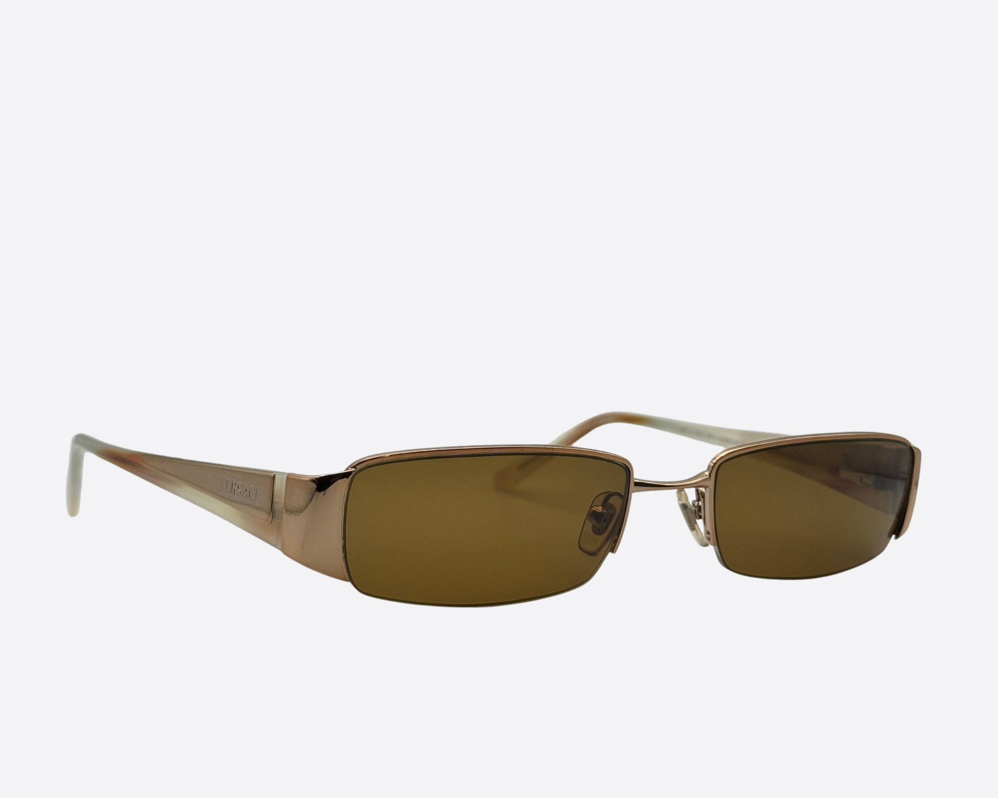 Versace designer sunglasses in a metallic copper finish with wrap-around aesthetic.