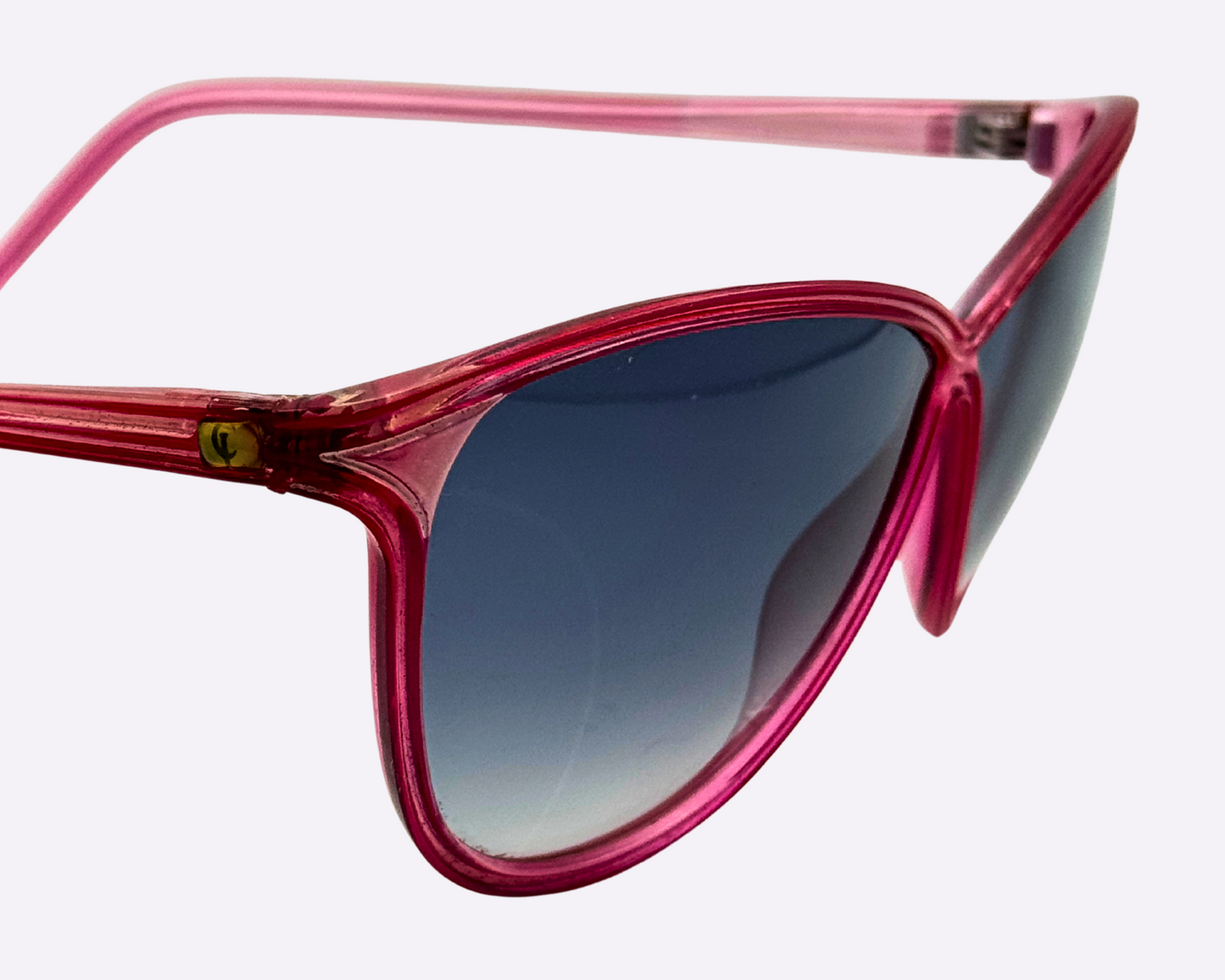 Close-up of Christian Latour pink sunglasses with new gradient grey lenses, showing the CL logo on the right temple.