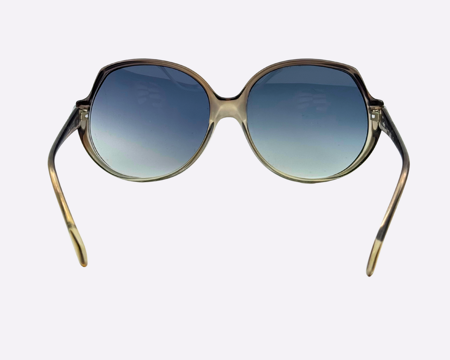 Rear view of vintage Indo sunglasses with oversized frame and new blue-grey gradient lenses