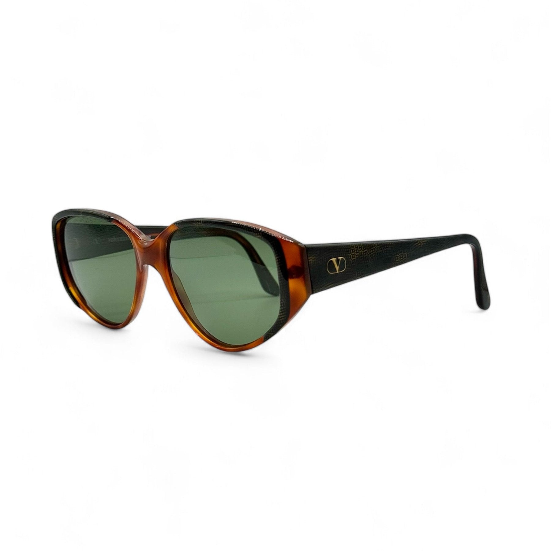 Side view of vintage 1980s sunglasses by Valentino, featuring brand new vibrant green lenses and an exotic reptile-skin pattern on the frame, showcasing excellent Italian craftsmanship.