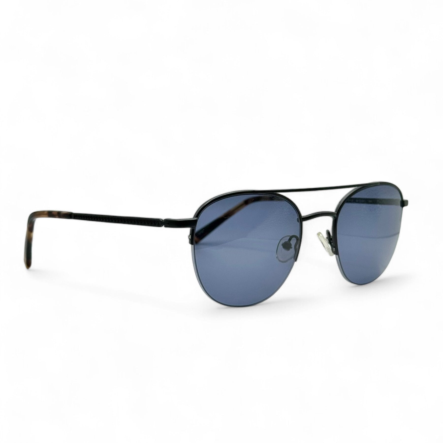 Side profile of Société des Lunetiers sunglasses featuring sleek black frames with dark blue lenses, made in France. Enhanced with new UV400 lenses for optimal eye protection and classic sophistication.