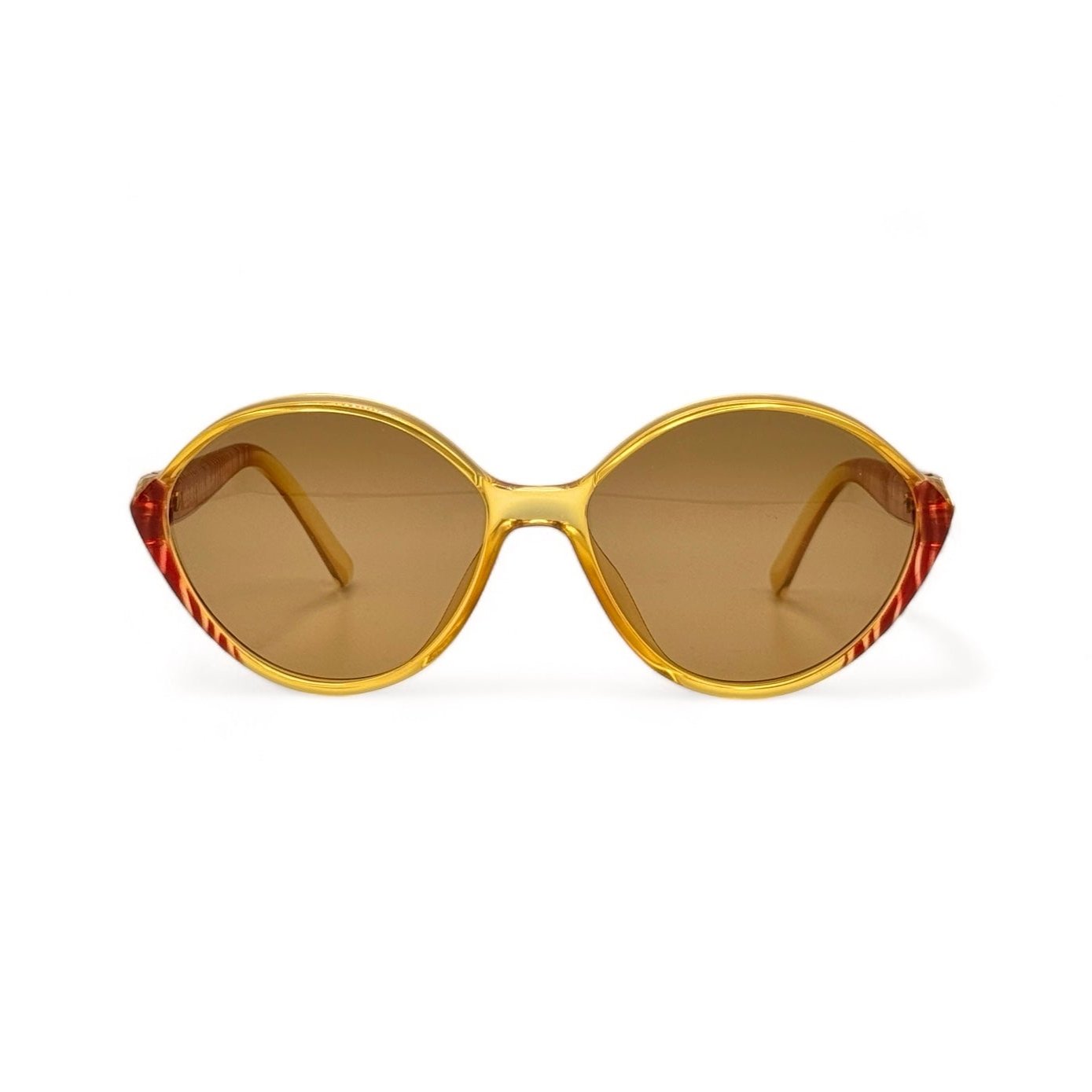 Front view of vintage Christian Dior eyewear from the 70s, featuring an oval frame with a gold and red zebra stripe pattern. Updated with new brown UV400 lenses for stylish sun protection, combining luxury with classic design.