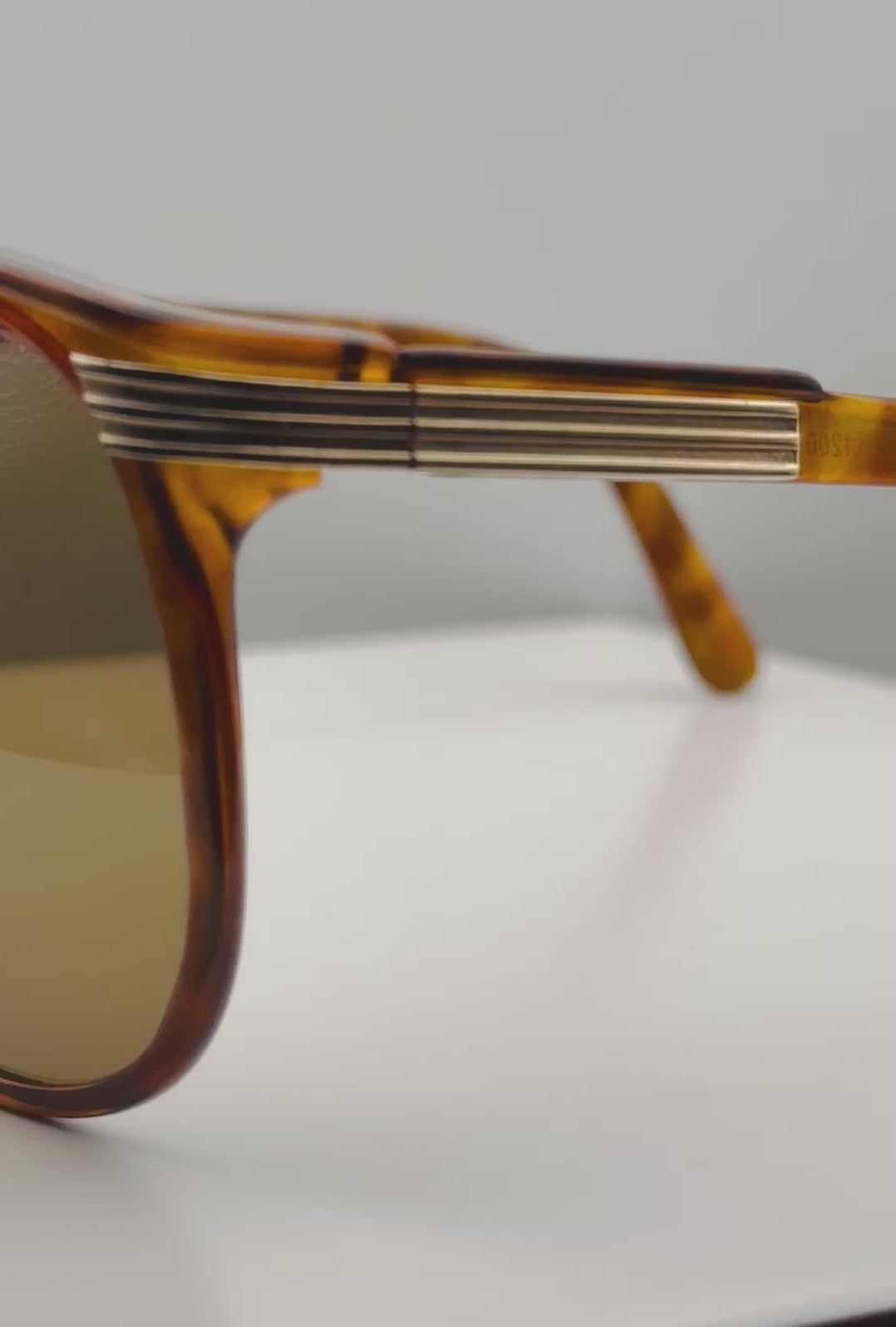 Video of vintage Viennaline 1200 sunglasses, rotating to show the glossy tortoiseshell finish, the geometric aviator shape, and the brand-new brown sun lenses from every angle.